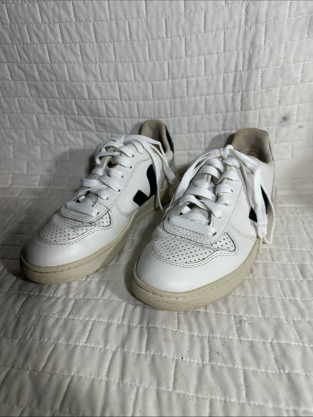 Veja V-10 leather low-top sneakers in white and black